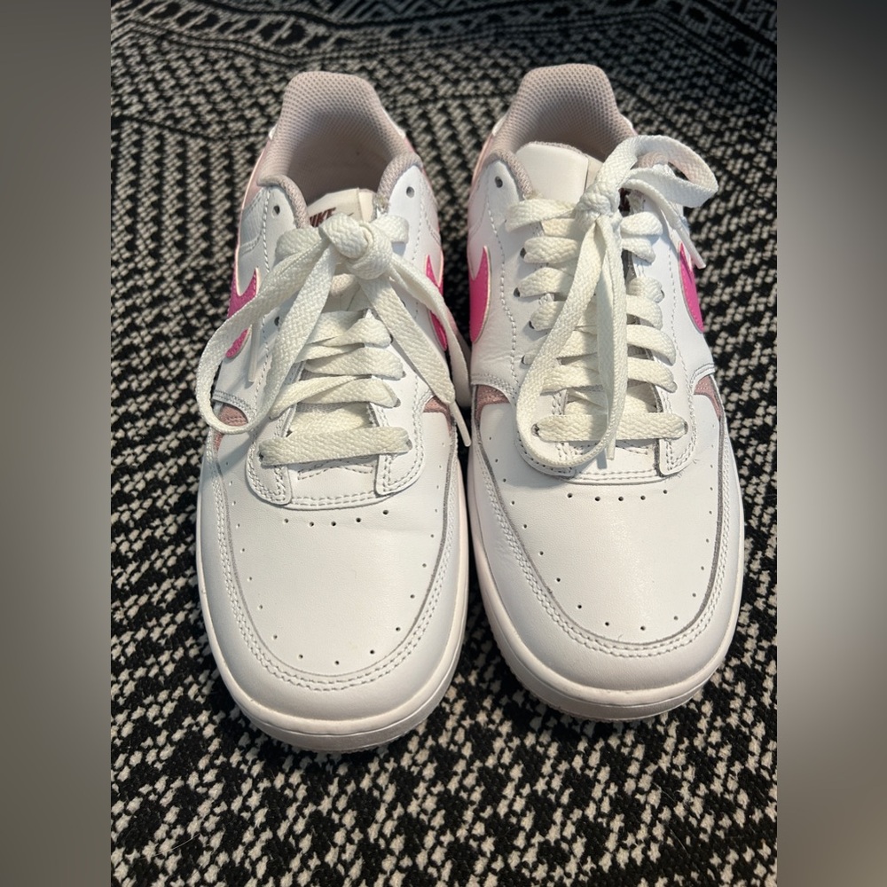 Women’s Pink and white Nikes gamma force